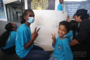 Limkokwing staff and students join hands with students from orphanages to leave their handprints on Founder’s Day celebrations